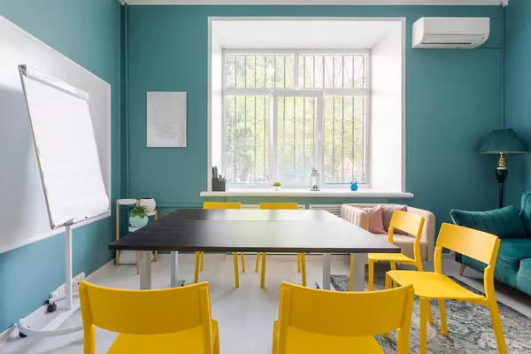 Room with a large desk and pencils