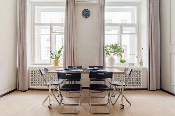 Hall with a large desk and many chairs